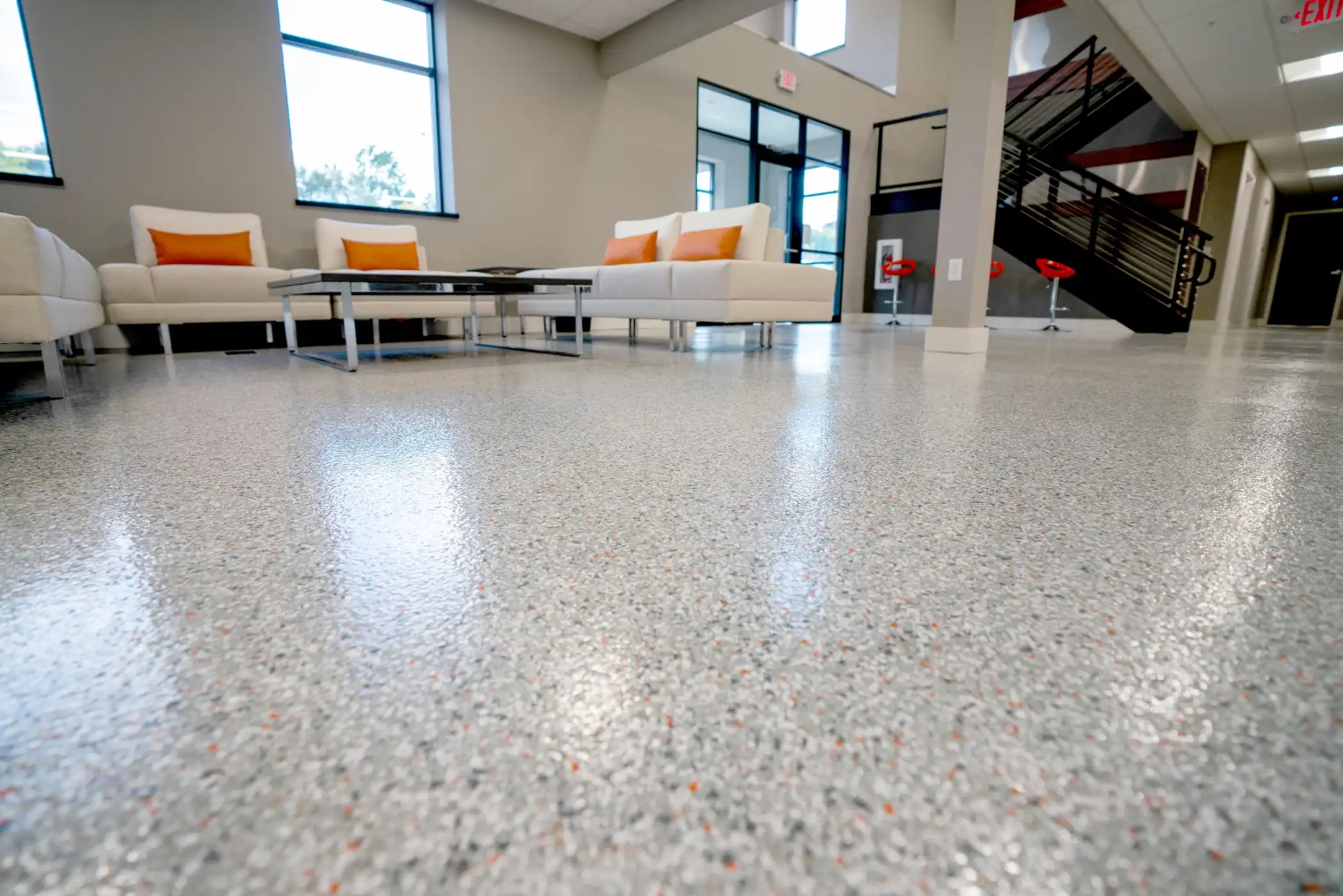 Finished flake floor coating with a polyaspartic topcoat