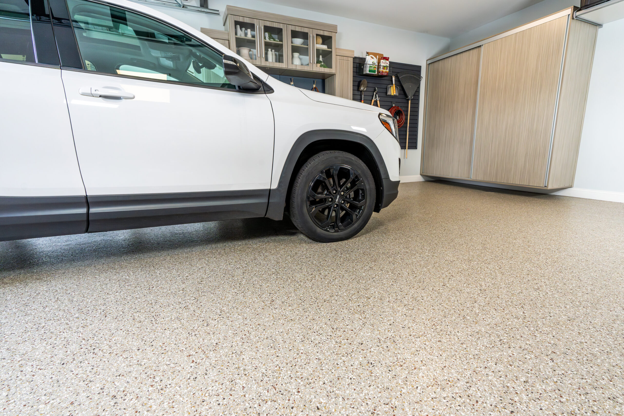 Modern garage with a Penntek coated floor