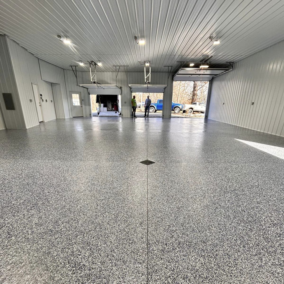 After — three-bay shop finished with a gray flake floor coating